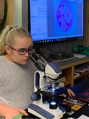 Tilamook Junior High student and microscope - Education grant from Oregon State Credit Union